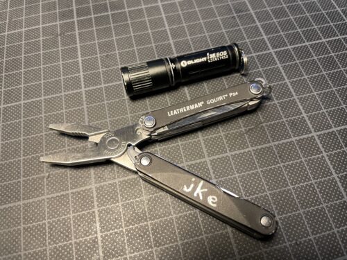 opened Leatherman Squirt PS4 and Olive i3E EOS